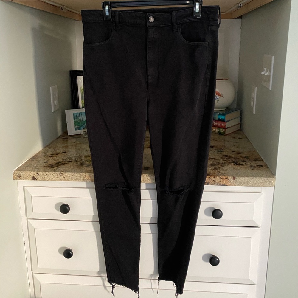 High waisted jeans with holes in both knees